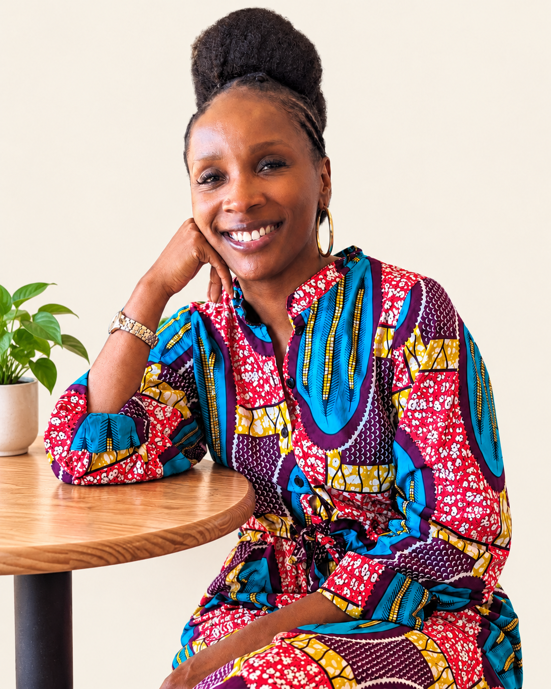 Aisha I. DeBerry wearing a colorful African print outfit
